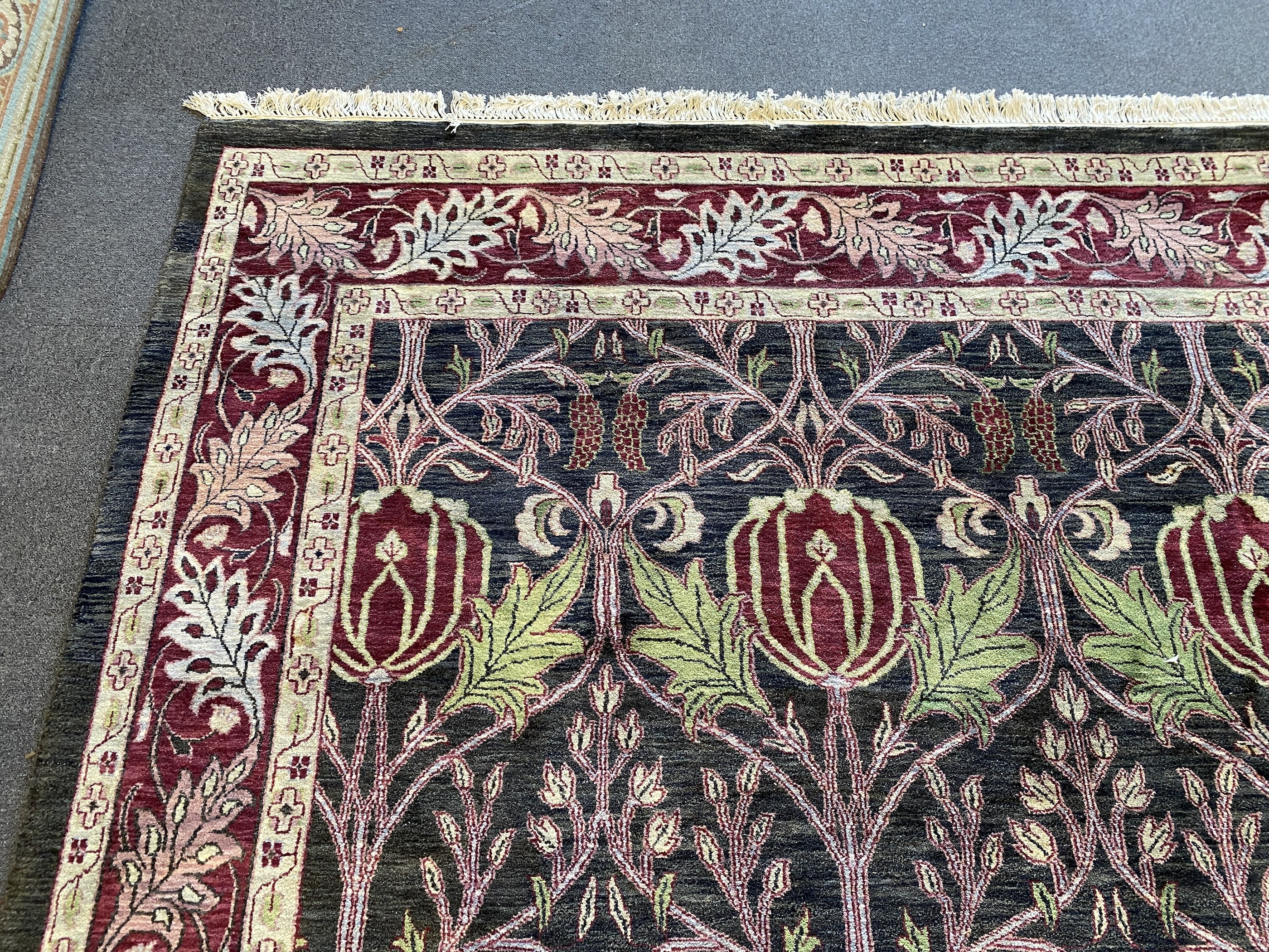 A large Indian Arts & Crafts style carpet, 541 x 358cm